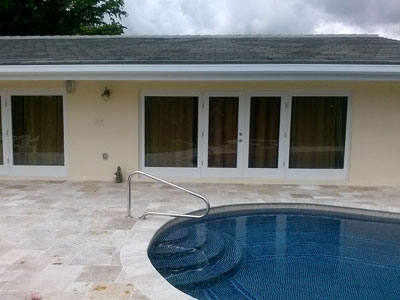 Impact sliders and travertine pool deck