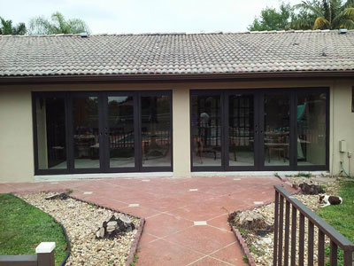 French impact doors on a patio and pool