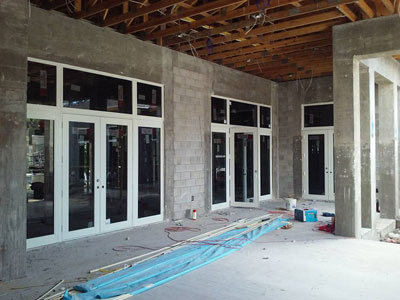 Ground-up new construction with impact storefront glass