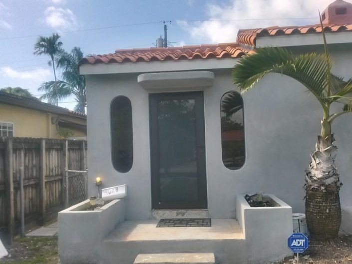 Impact entry door and oval accent windows